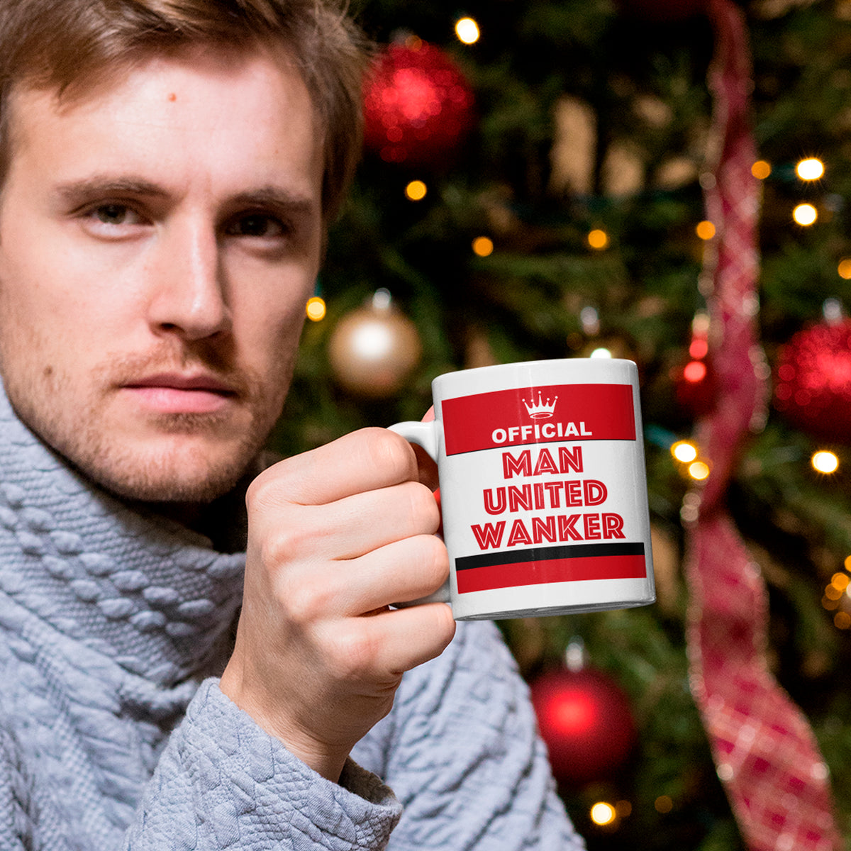 Person holding Manchester United themed mug – fun football Christmas gift for Red Devils supporters